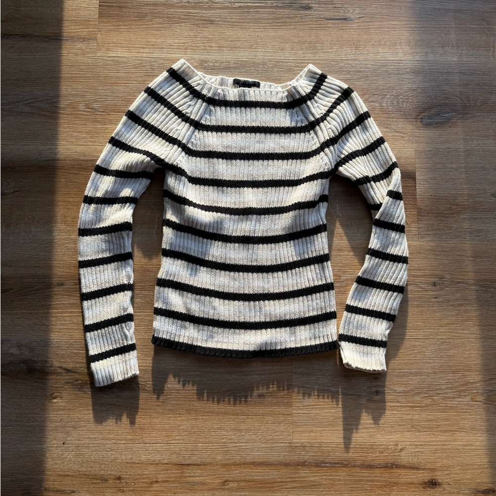 The limited off the shoulder cream white and black sweater